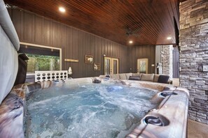Relax in the hot tub at Blue Haven Luxury Cabin