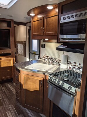 Kitchen area, door is beyond that and then the passageway to the "master bed"