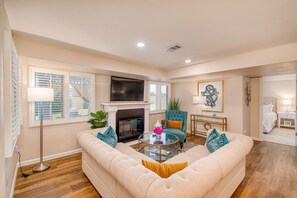 The main living area with fireplace and HD TV. (2nd TV is in the main bedroom).