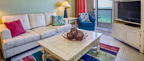 Bright and relaxing living room that opens directly onto the spacious balcony.