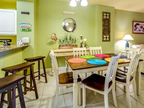 Seating for 6 at the dining table, with 3 bar stools at the kitchen counter.