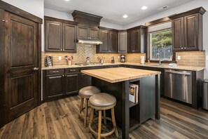 Grizzly Den: - Fully stocked chef's kitchen with a center island and seating for 2.