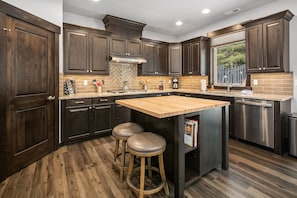 Grizzly Den: - Fully stocked chef's kitchen with a center island and seating for 2.