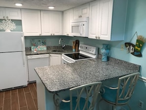 Fully stocked, clean, organized kitchen. 