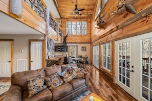 Main level, looking from fireplace towards dining area and kitchen