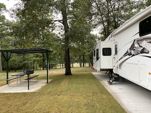 Each rv site has concrete pad with 30 and 50 amp service, covered picnic tables 