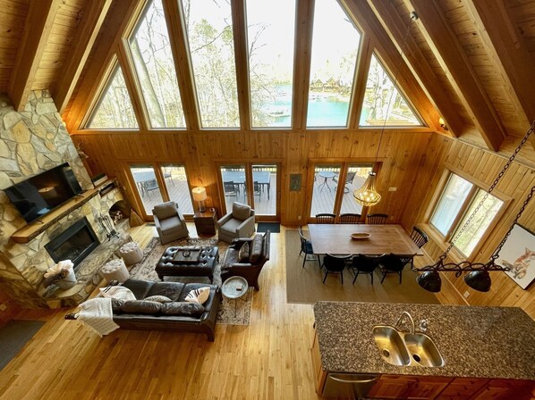 View of main floor living/dining area from loft bedroom