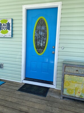 Bright and cheery beach colors greet you at Palm View House! One block to beach.