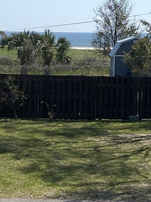 Enjoy a direct view of the sandy beach of the Gulf of Mexico from large porch.