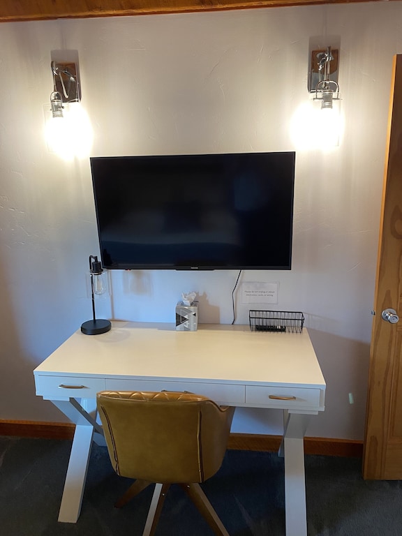 Desk and tv in main floor bedroom