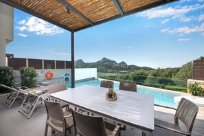 Shaded outdoor dining area perfect for al fresco dining with friends and family