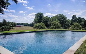 Pool area includes comfortable lounge chairs