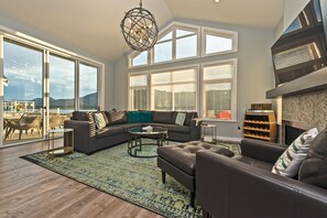 Large, spacious living, dining, and kitchen areas offering spectacular views of the lake. 
