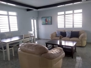 living room with air conditioners, smart tv and wifi