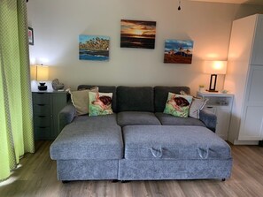 Versatile and brand new cozy sofa/couch that pulls out to a comfortable queen size bed when you want to just stretch out, or if you have up to 4 guests staying here for your vacation.
