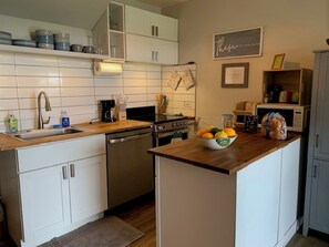 Freshly renovated kitchen area with quiet dishwasher and all of your meal preparation needs right at your fingertips.  Enjoy cooking with all of the cookware and utensils you will need, including two sizes of coffee makers, a salad-spinner for your fresh greens from the market, and so much more!