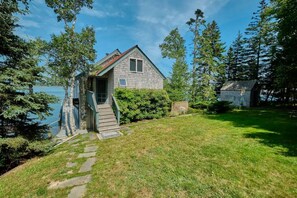 Back side view of the house and the sleeping cabin is to the right.