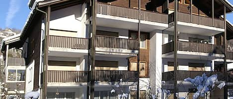 Sky, Building, Property, Window, Snow, Plant, Slope, House, Shade, Siding