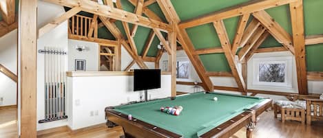 The game room is both elegant and the perfect space for entertainment.