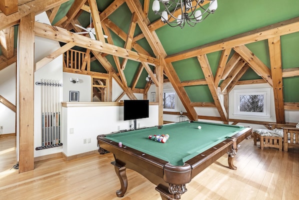 The game room is both elegant and the perfect space for entertainment.