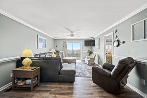 The ocean front living room is well-appointed with comfortable furnishings.