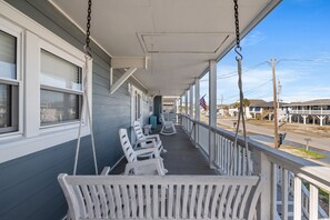 Lounge in one of the porch swings while enjoying a cool ocean breeze.