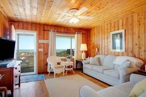 The ocean front living room is well-appointed with comfortable furnishings