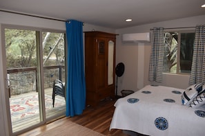 Bedroom with entrance to deck