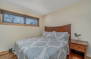 King size bed. Includes closet with hangers and dresser for clothing storage.
