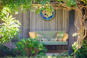 The swing next to the front door...a perfect place to begin, and end, your day.