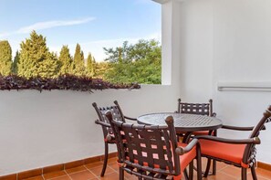 A cozy balcony setting with a view, ideal for sipping coffee and soaking in the surroundings.