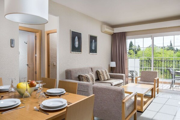 An inviting open-plan living and dining area that flows seamlessly, perfect for gatherings or quiet evenings in.
