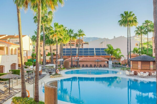 Inviting outdoor pool with ample lounging space to soak up the sun.