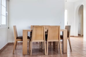 Gather around this sleek dining table for a family feast or a friendly get-together.