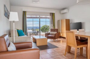 Bright and airy living space combines modern comfort with stunning ocean views.