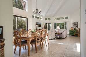 Living & Dining Area: Sunlit space perfect for meals and relaxation with great outdoor views!