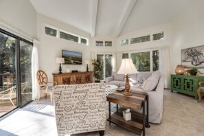 Living Room: Bright and airy space with stylish decor and inviting views of nature outside!