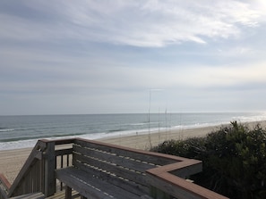 Enjoy beach and sunset views from the walkway seating area