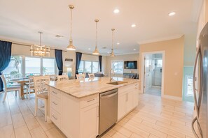 A spacious island, modern appliances, and elegant finishes throughout. The open-concept layout makes it perfect for gathering.