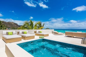 Jacuzzi and chaise loungers on 2nd floor deck