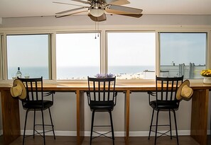 14 foot oak bar overlooking the beach.  Windows open to catch the ocean breeze