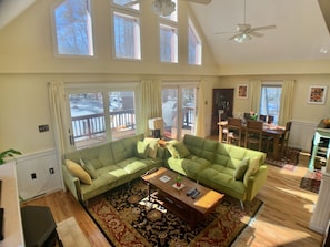 Easy access to the deck from vaulted ceiling living room.
