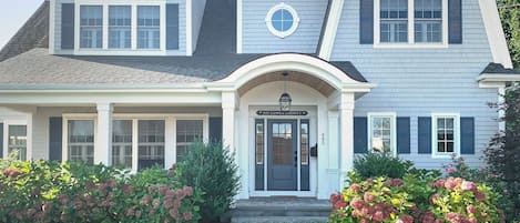 Welcome to Hangar Sea with Beautiful hydrangea framed front entry way -45 Lower County Rd Harwich- Cape Cod- New England Vacation Rentals.
