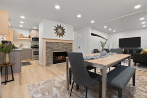 The kitchen, dining, and living areas flow together. Table comfortably seats 6!