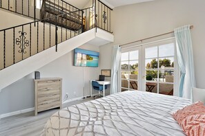 Master bedroom, with workspace, opens to loft above, 2nd floor