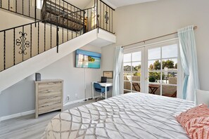 Master bedroom, with workspace, opens to loft above, 2nd floor