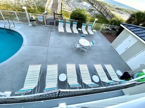 New pool deck furniture, looking down from the unit.  Grilling area to right