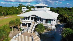 Wrap Around Decks on Every Level with  Multiple Island Gulf Views and Seating