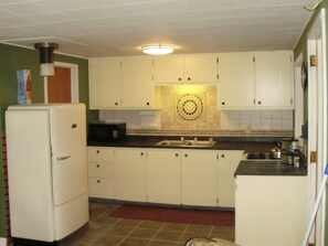 Fully furnished kitchen provides all the ammenities of home.