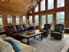 Spacious living room with a gas fire for use during the winter months.